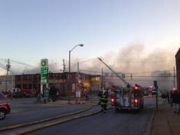 Firefighters fighting a fire in Remington